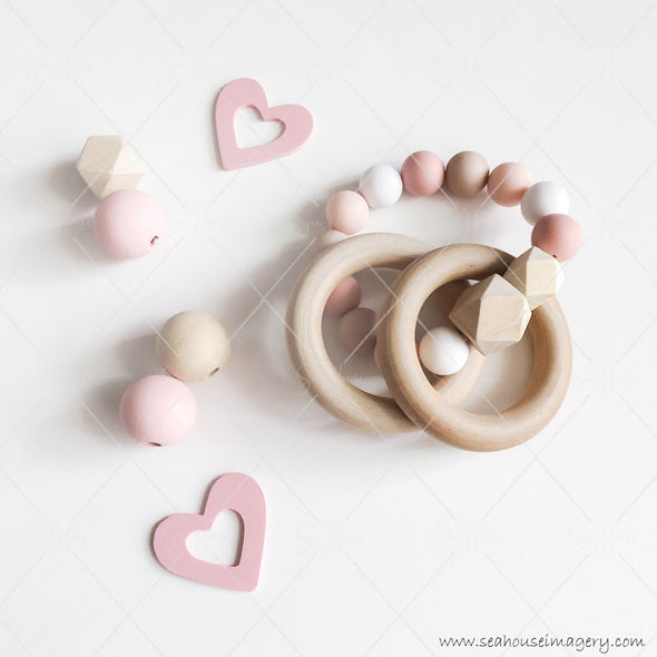 WM STOCK PHOTO Mums & Bubs Baby Girl Wooden Rings & Bead Rattle Pink Hearts on Left 5848 Square Size